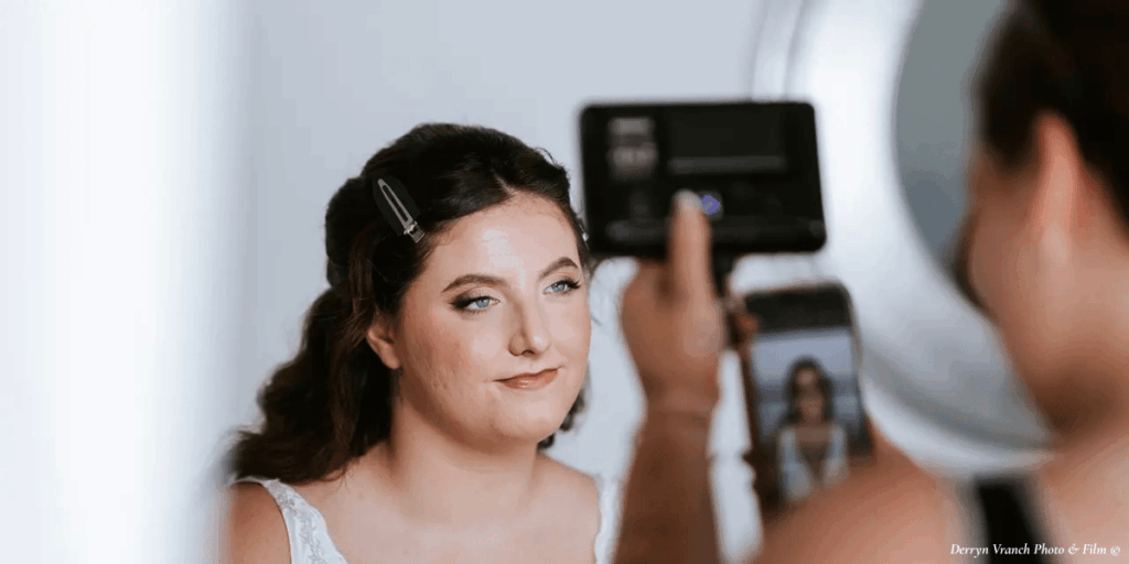 bride-makeup-applied-being-photographed
